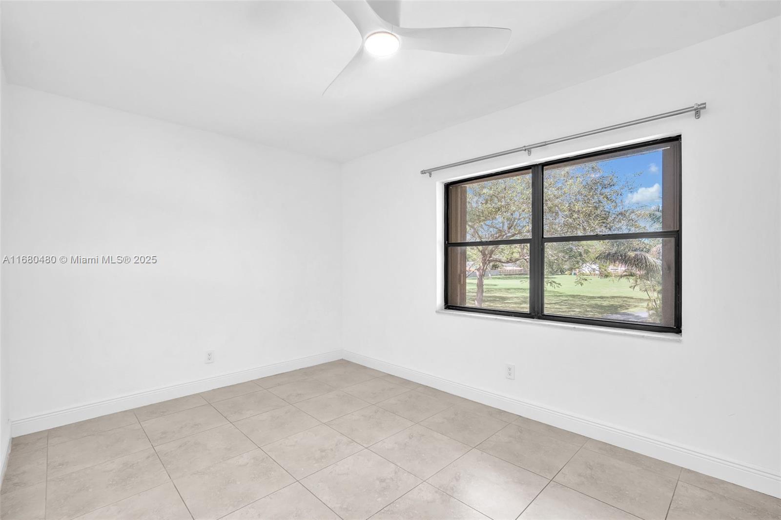 11533 Southwest 109th Road, Unit 21G Miami, FL 33176 - Photo 19 of 39 an empty room with a window