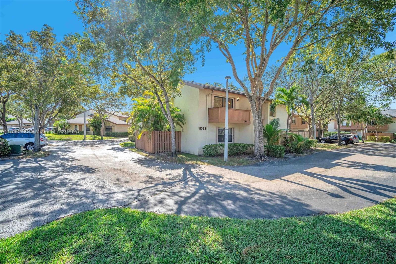 11533 Southwest 109th Road, Unit 21G Miami, FL 33176 - Photo 2 of 39 a view of a yard with plants and trees
