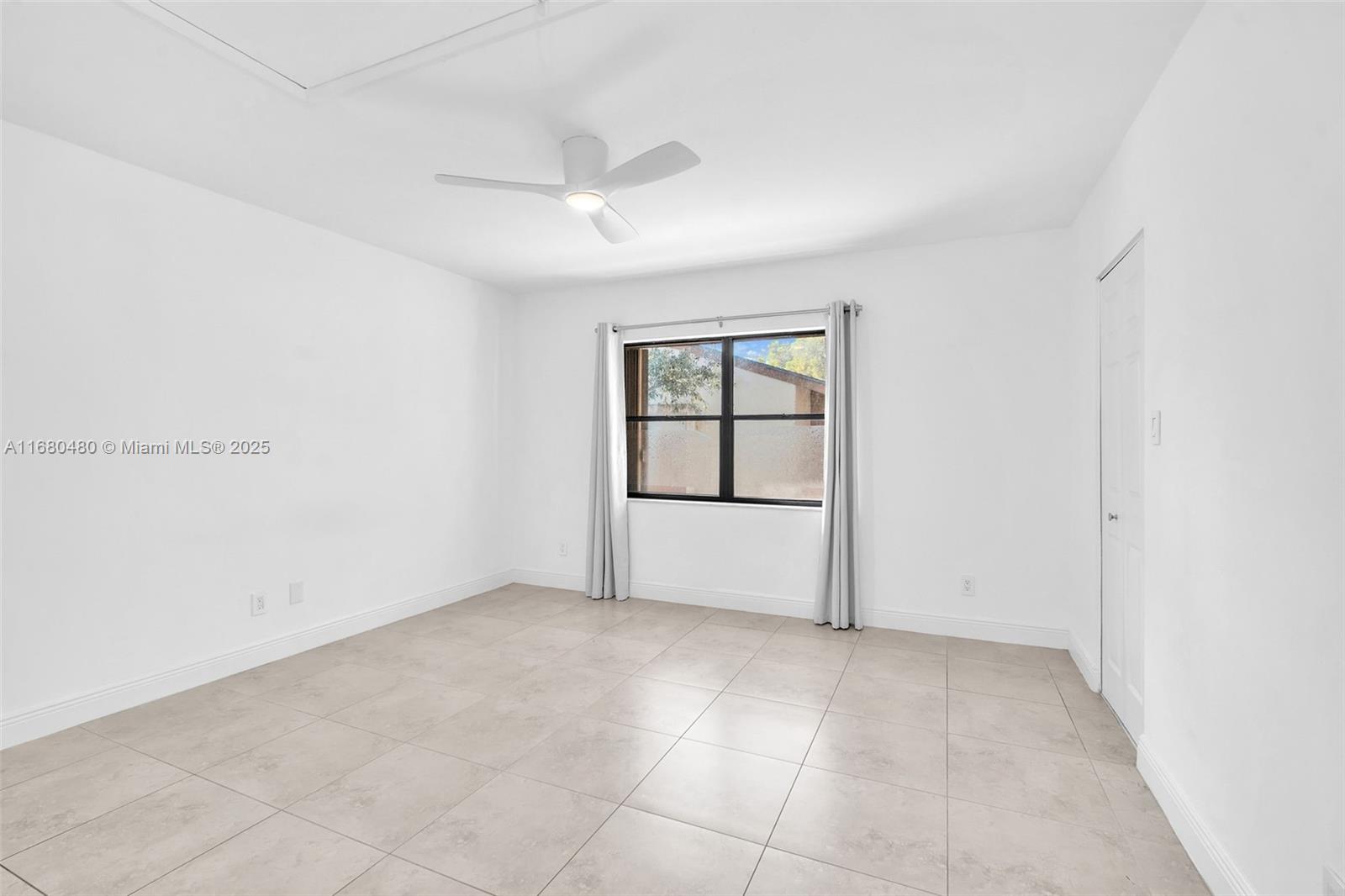 11533 Southwest 109th Road, Unit 21G Miami, FL 33176 - Photo 22 of 39 an empty room with windows