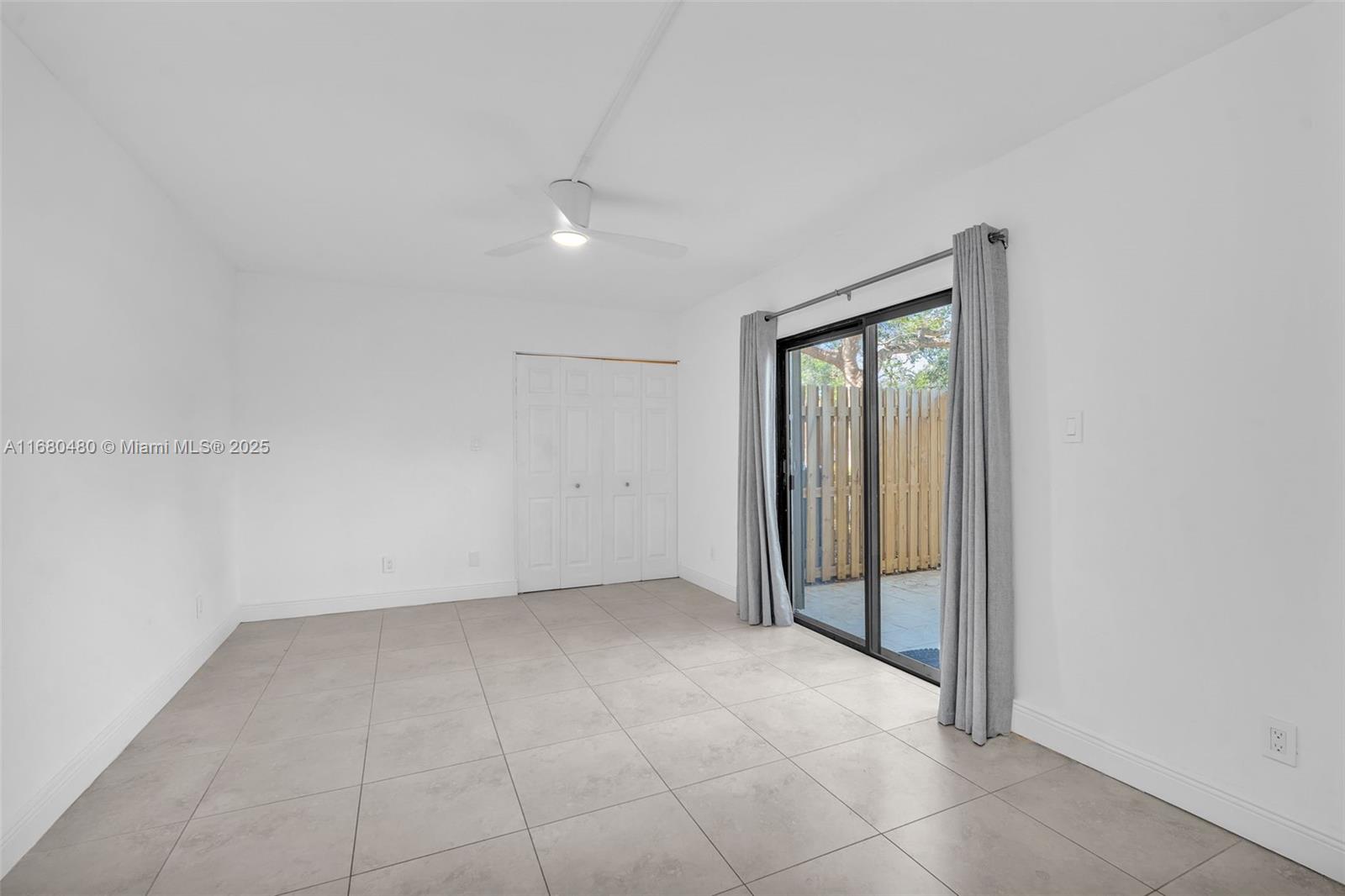 11533 Southwest 109th Road, Unit 21G Miami, FL 33176 - Photo 30 of 39 an empty room with a natural light