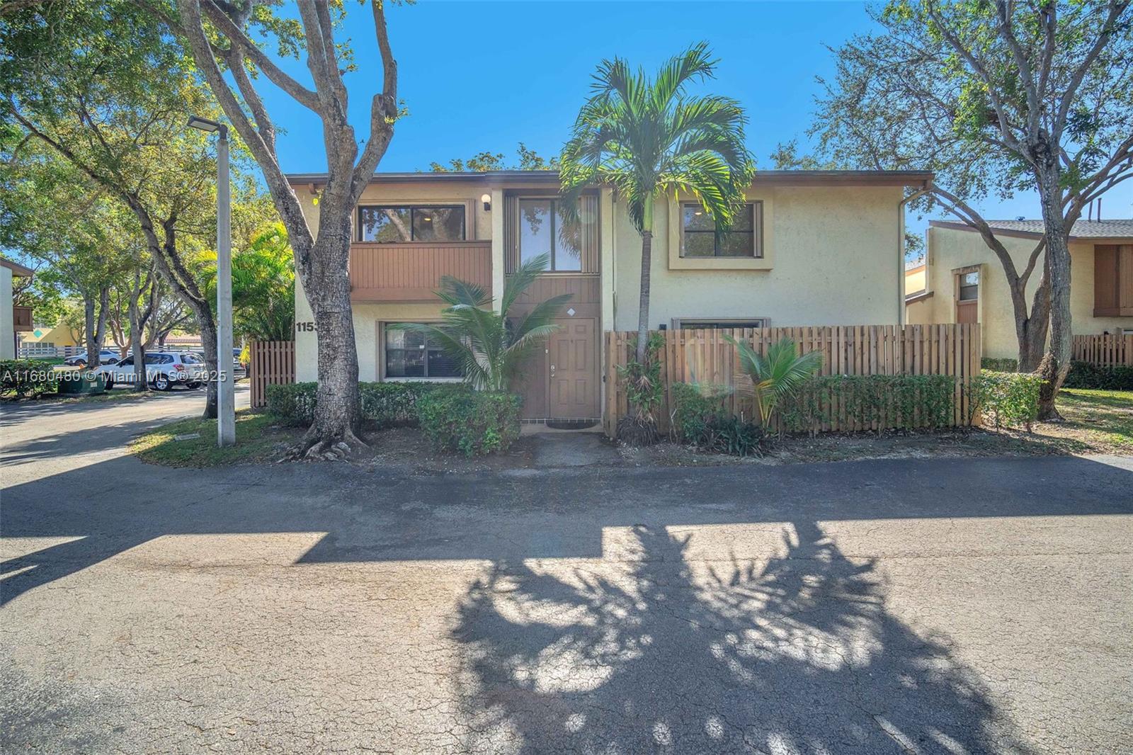 11533 Southwest 109th Road, Unit 21G Miami, FL 33176 - Photo 3 of 39 a front view of a house with garden