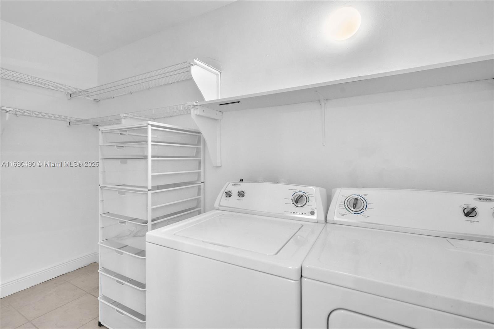 11533 Southwest 109th Road, Unit 21G Miami, FL 33176 - Photo 33 of 39 a utility room with dryer and washer