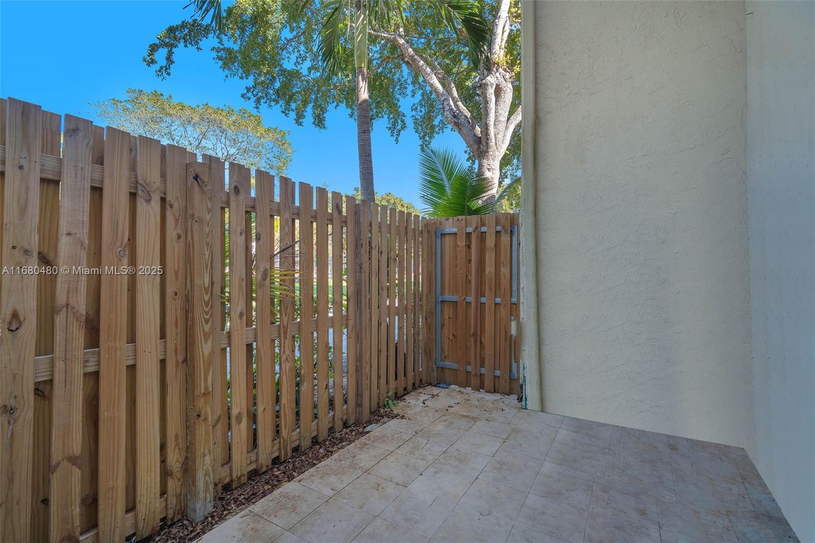 11533 Southwest 109th Road, Unit 21G Miami, FL 33176 - Photo 34 of 39 a view of a wooden fence