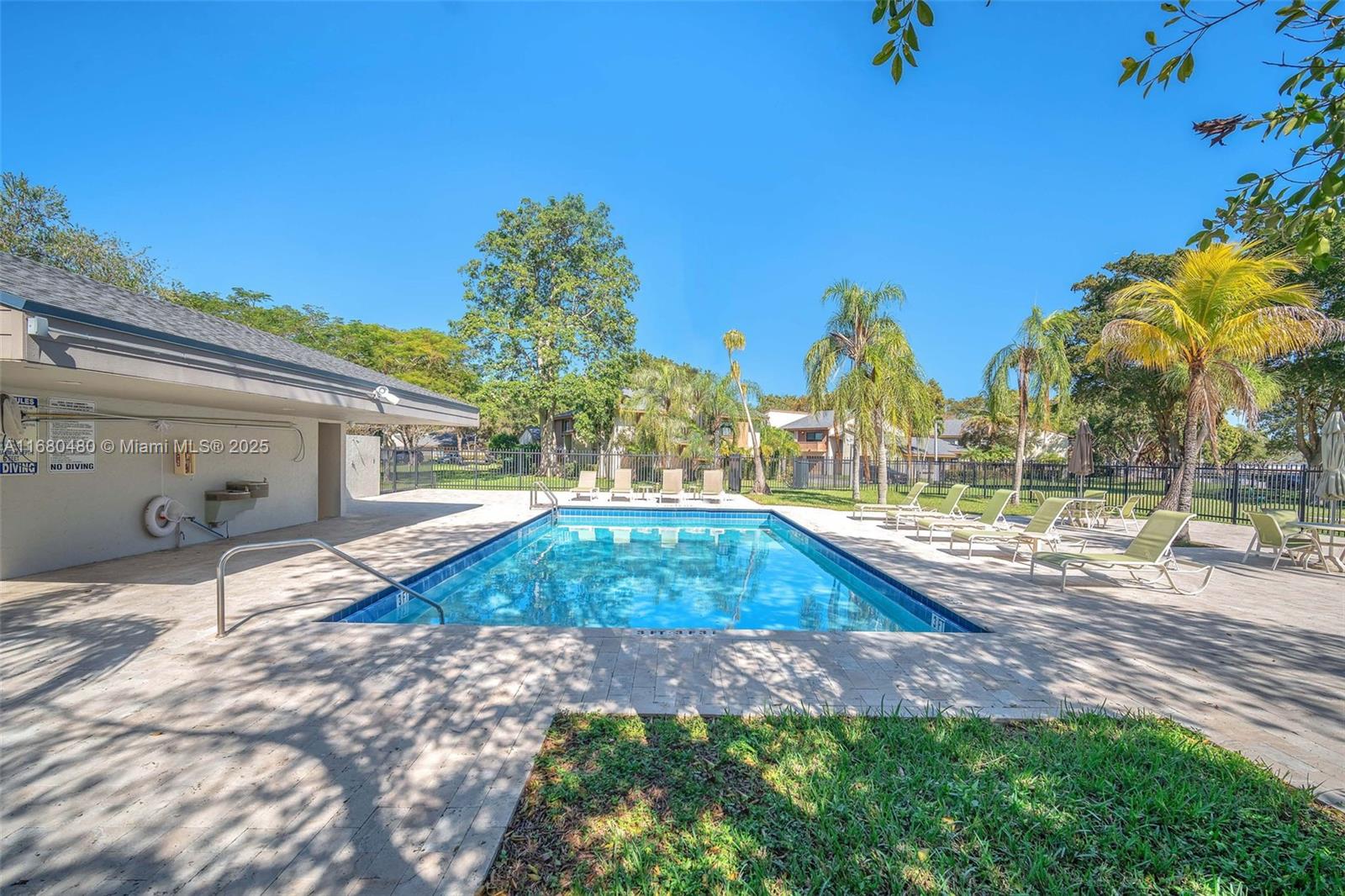11533 Southwest 109th Road, Unit 21G Miami, FL 33176 - Photo 36 of 39 a house view with a backyard space