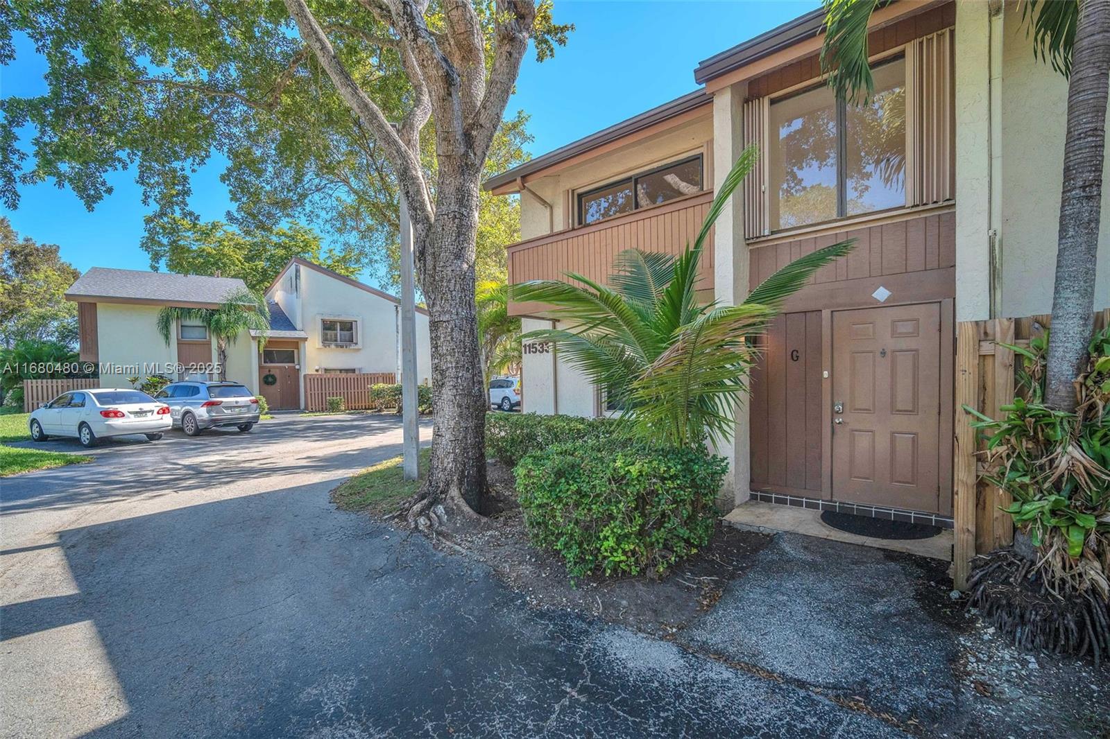 11533 Southwest 109th Road, Unit 21G Miami, FL 33176 - Photo 4 of 39 a house view with a outdoor space