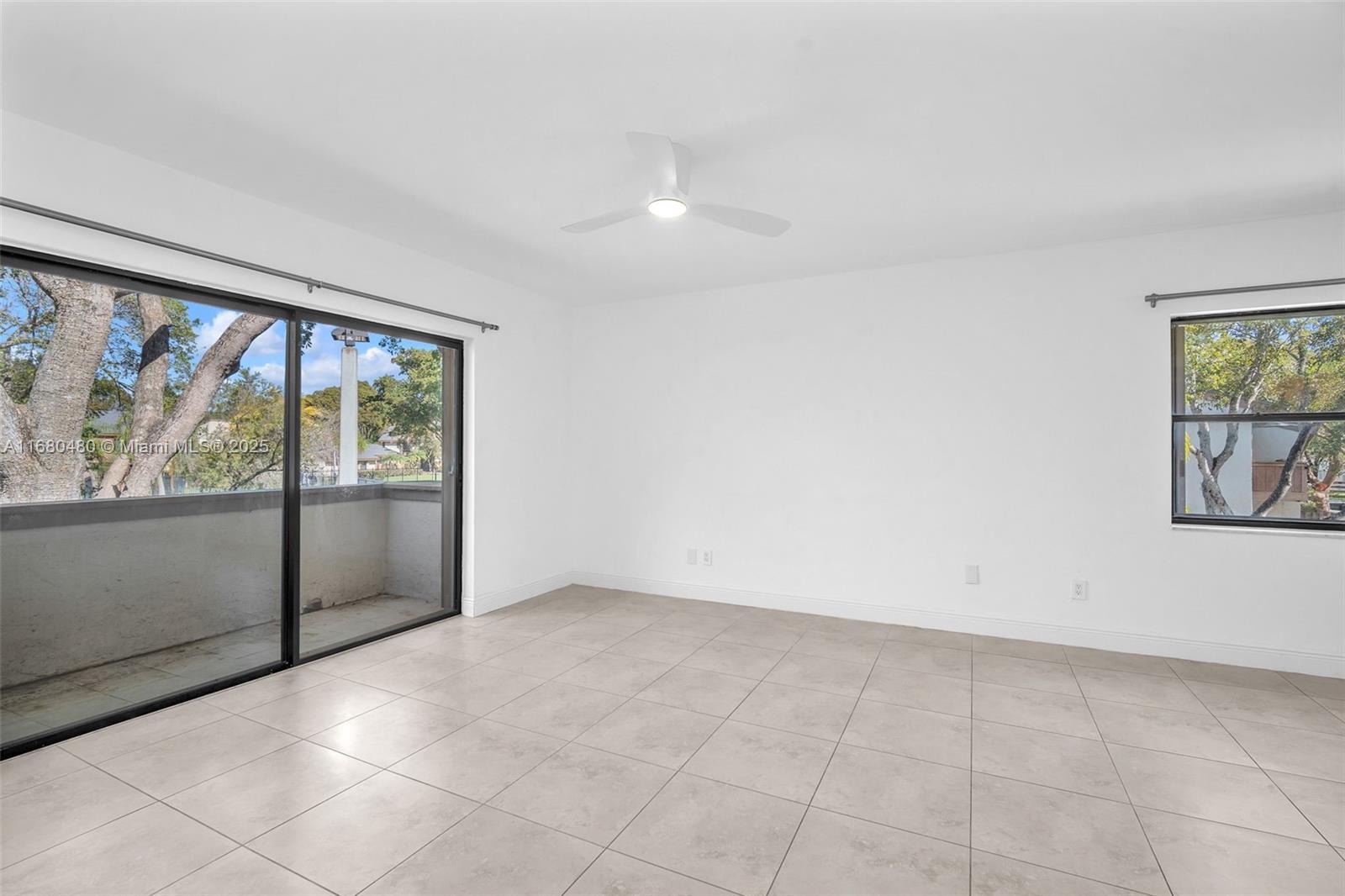11533 Southwest 109th Road, Unit 21G Miami, FL 33176 - Photo 6 of 39 an empty room with windows