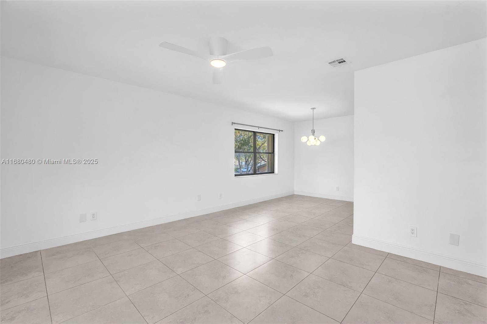11533 Southwest 109th Road, Unit 21G Miami, FL 33176 - Photo 9 of 39 an empty room with a empty space and windows