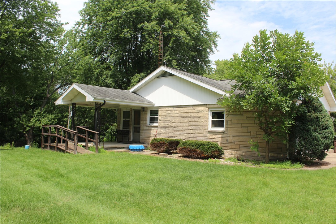 12735 Catlin Tilton Road Catlin, IL 61817 - Photo 3 of 22 a backyard of a house with table and chairs