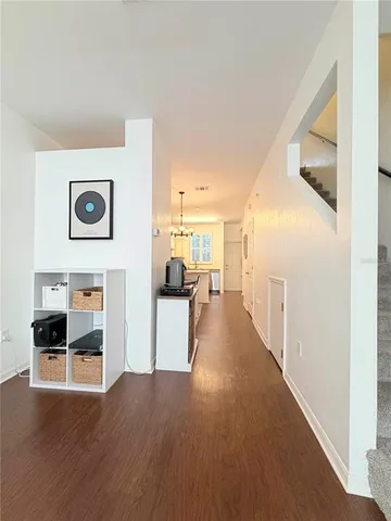 a view of living room with furniture and wooden floor