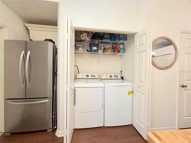 a view of storage and utility room with washer and dryer