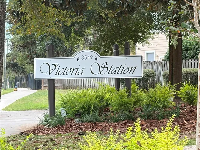 a street sign that is sitting in the grass