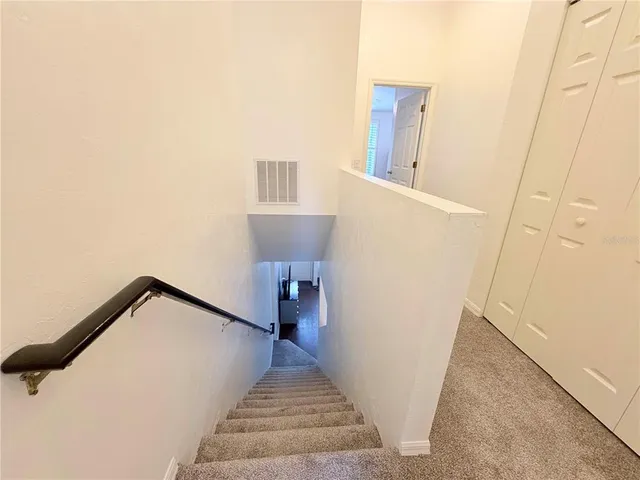 a view of a hallway with staircase