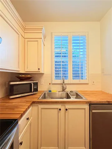 a kitchen with granite countertop a sink and a granite counter tops