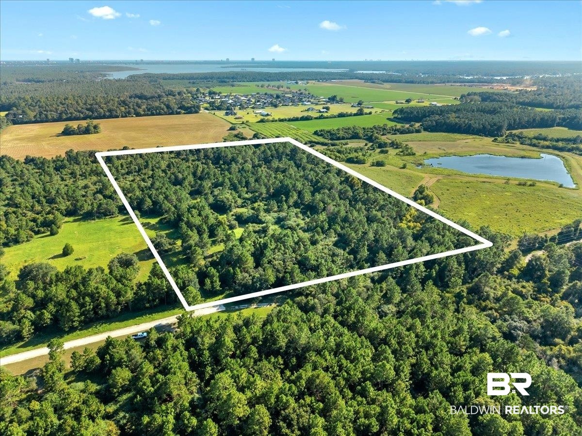 0 Stucki Road Elberta, AL 36530 - Photo 2 of 15 Aerial view of property and surrounding area featuring property parcel outlined and a nearby body of water