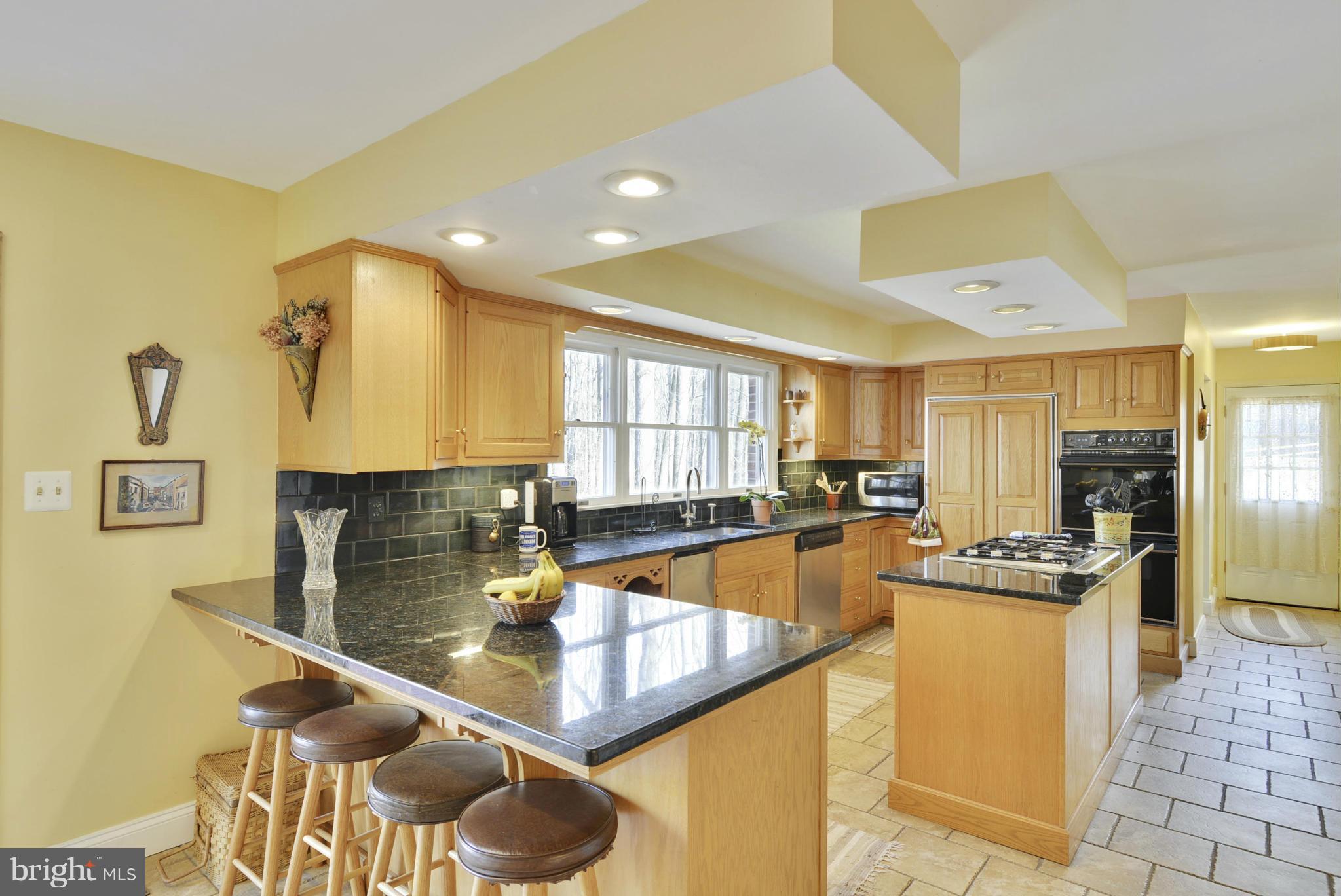 9 Redgate Court Silver Spring, MD 20905 - Photo 2 of 29 a kitchen with stainless steel appliances granite countertop a sink and a refrigerator