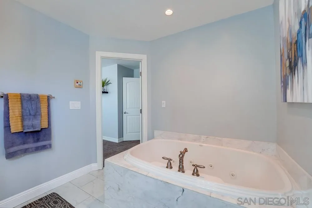 9055 Rosedale Drive Spring Valley, CA 91977 - Photo 24 of 38 a bathroom with a bathtub