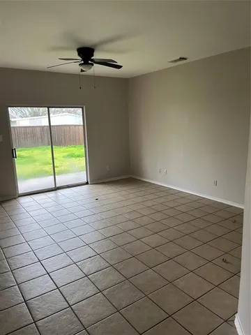 a view of an empty room and a window