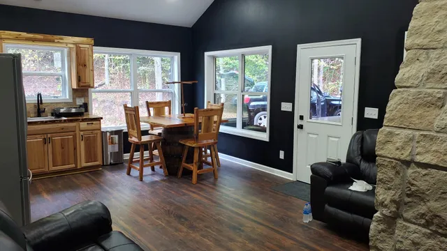 a view of a livingroom with furniture window and wooden floor