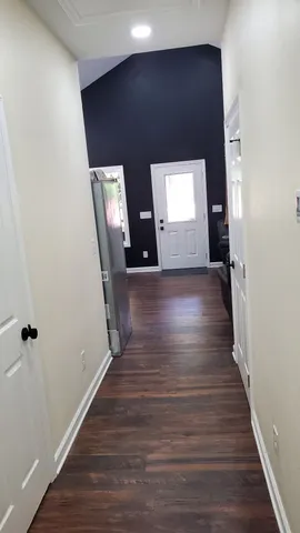 a bathroom with a toilet and a mirror