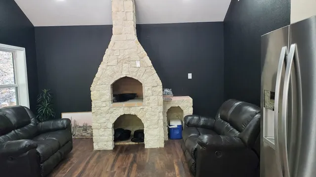 a living room with furniture and a fireplace