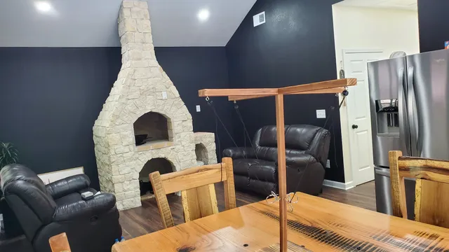 a view of a hallway with wooden floor and closet