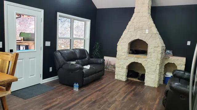 a view of porch with furniture and a backyard