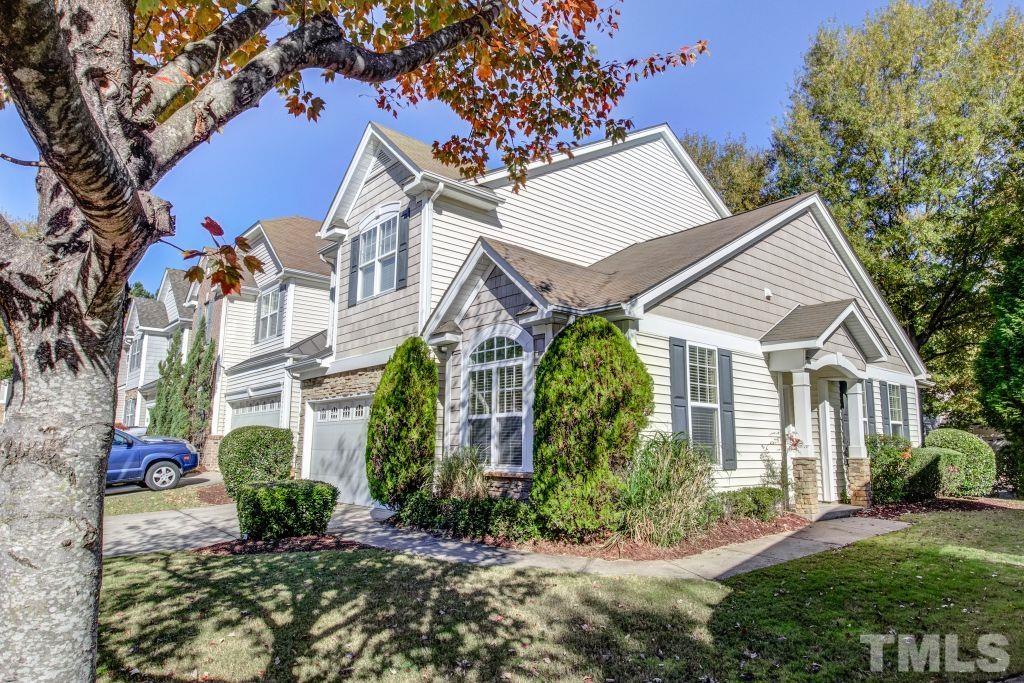 8306 Flat Keystone Drive Raleigh, NC 27613 - Photo 2 of 30 a view of a white house next to a yard with plants and trees