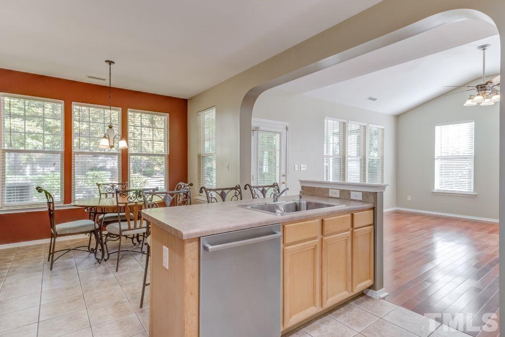 8306 Flat Keystone Drive Raleigh, NC 27613 - Photo 12 of 30 a very nice looking dining room with a large window