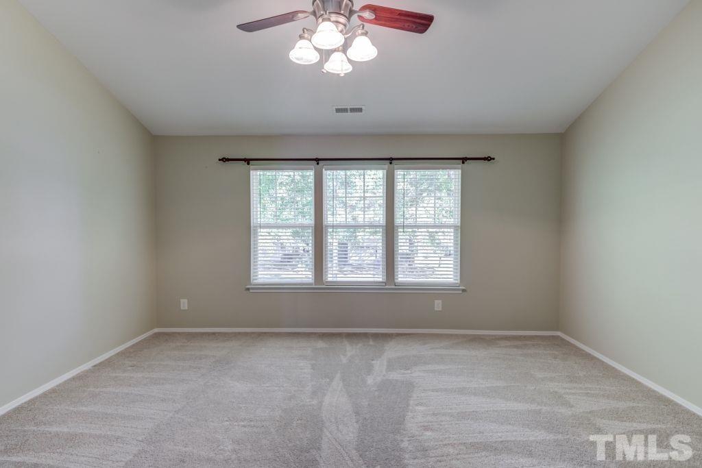 8306 Flat Keystone Drive Raleigh, NC 27613 - Photo 17 of 30 a view of an empty room with a window