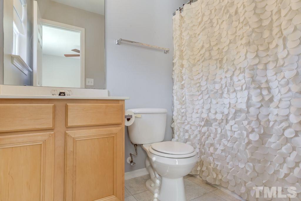 8306 Flat Keystone Drive Raleigh, NC 27613 - Photo 25 of 30 a bathroom with a toilet and a sink
