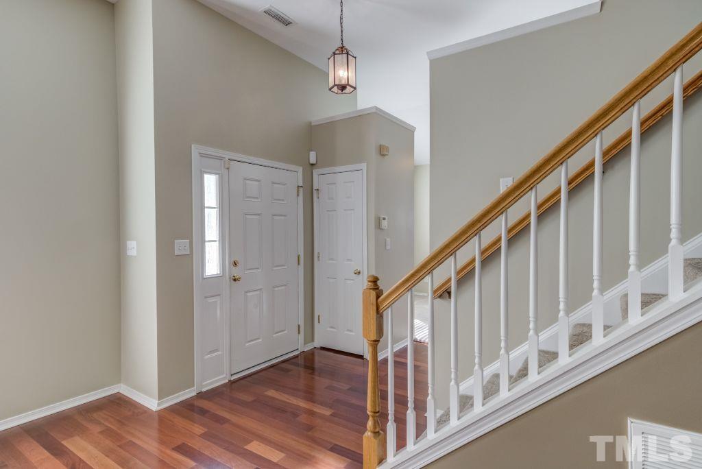 8306 Flat Keystone Drive Raleigh, NC 27613 - Photo 5 of 30 a view of an entryway with wooden floor