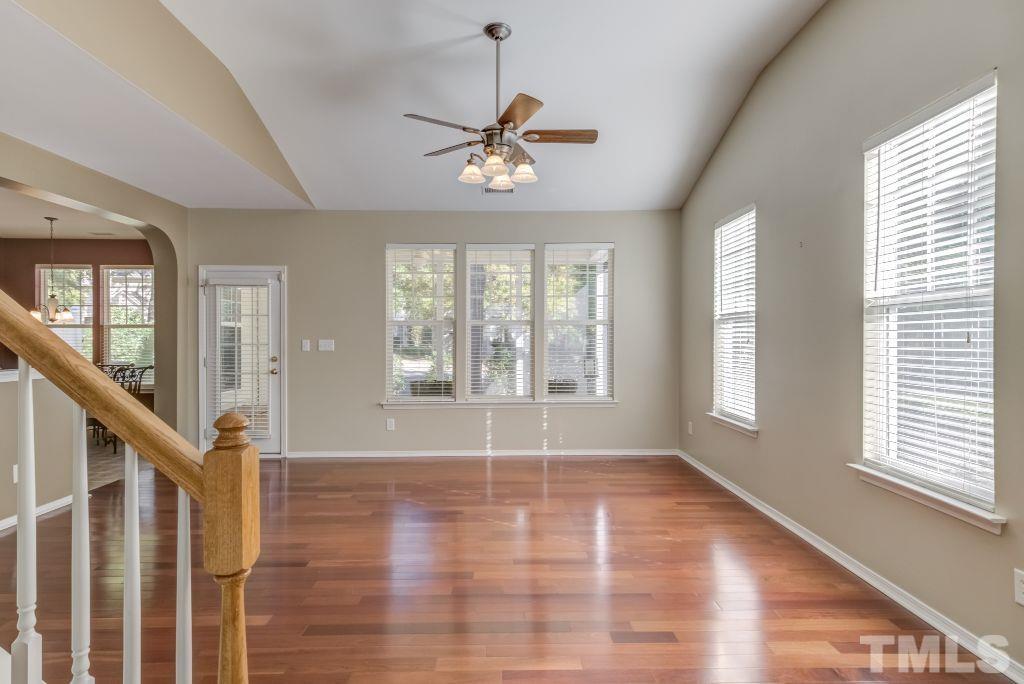 8306 Flat Keystone Drive Raleigh, NC 27613 - Photo 7 of 30 a view of empty room with wooden floor and fan