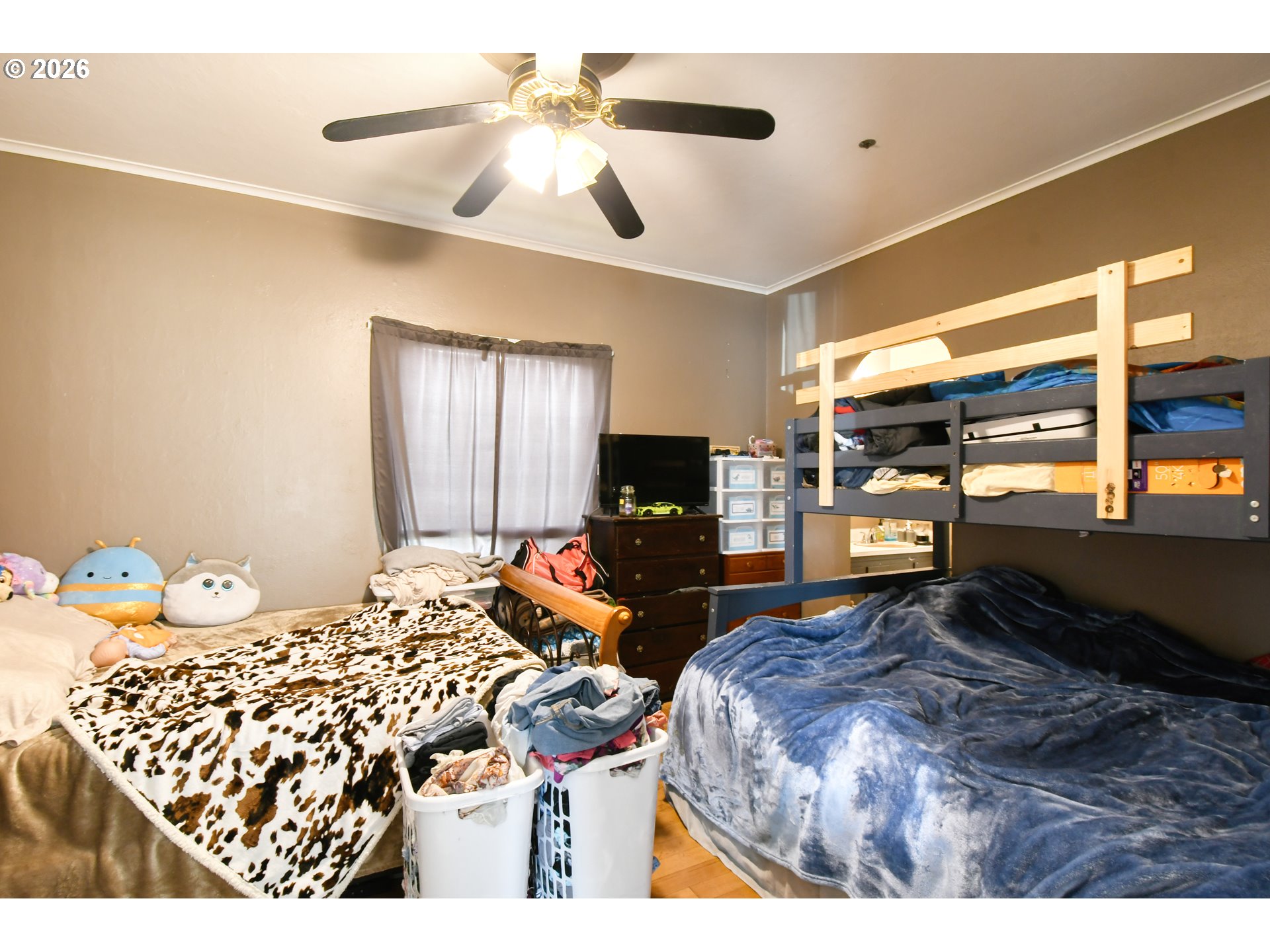 607 Southwest Court Avenue Pendleton, OR 97801 - Photo 24 of 48 a bedroom with a bed and wooden floor