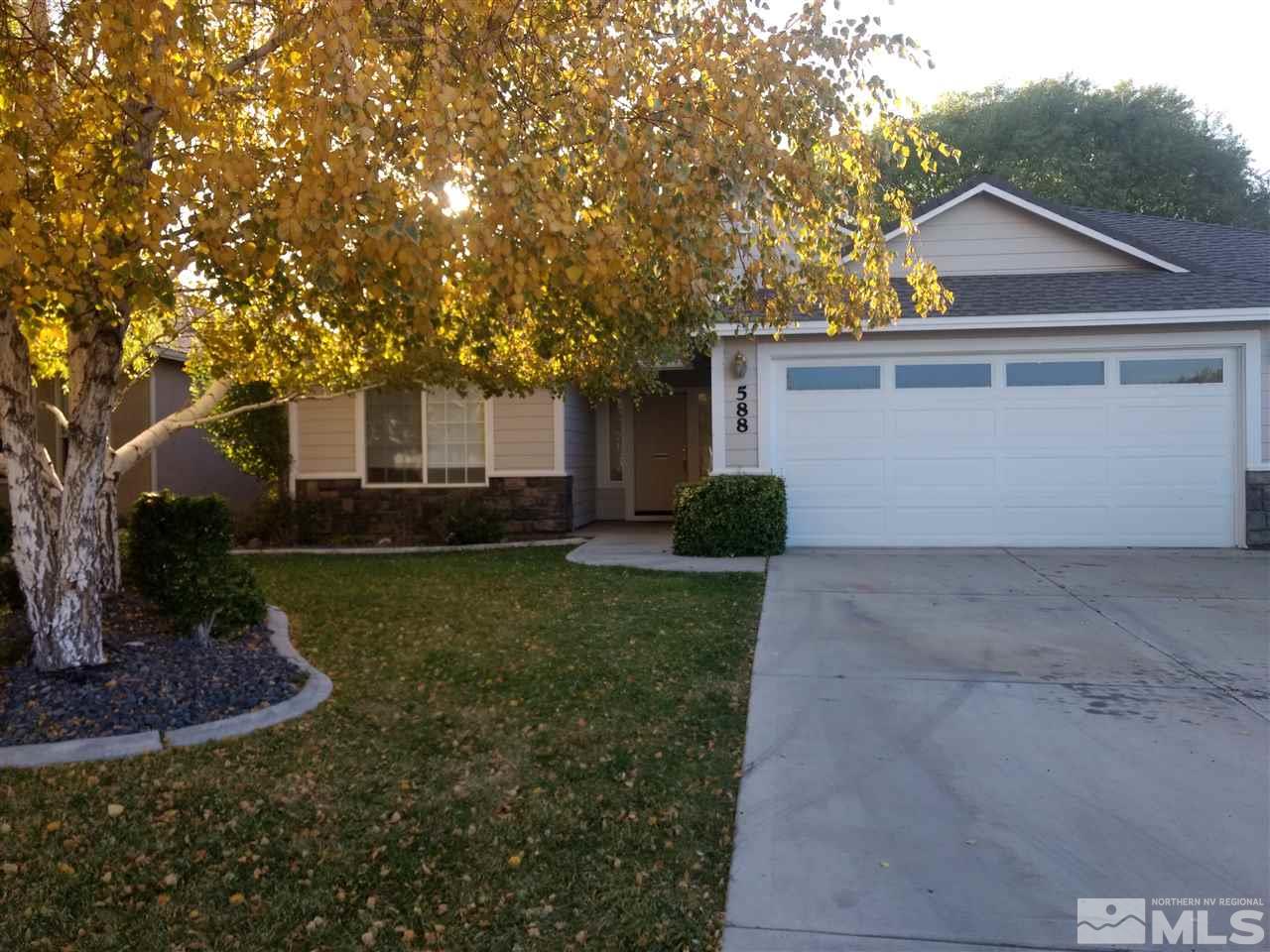 588 Wedge Lane Fernley, NV 89408 - Photo 1 of 1 a view of a house with a yard and large tree