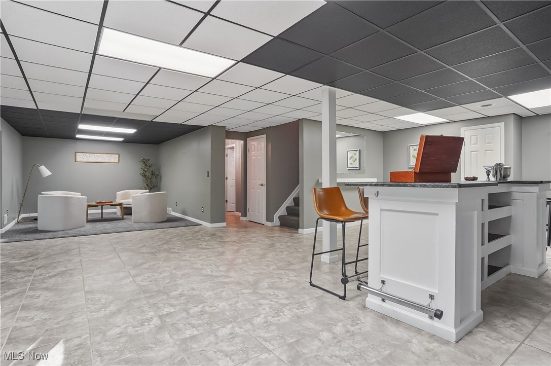 370 Wilcox Road Youngstown, OH 44515 - Photo 35 of 49 Bar area featuring a drop ceiling and stairway