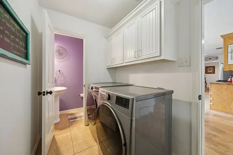 a view of a kitchen with washer and dryer