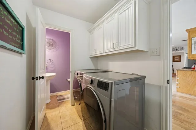 a view of a kitchen with washer and dryer