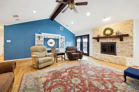 a bedroom with furniture and a fireplace