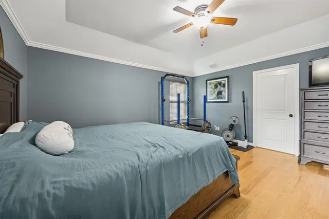 a bedroom with a bed and dresser