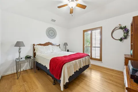 a bedroom with bed and window
