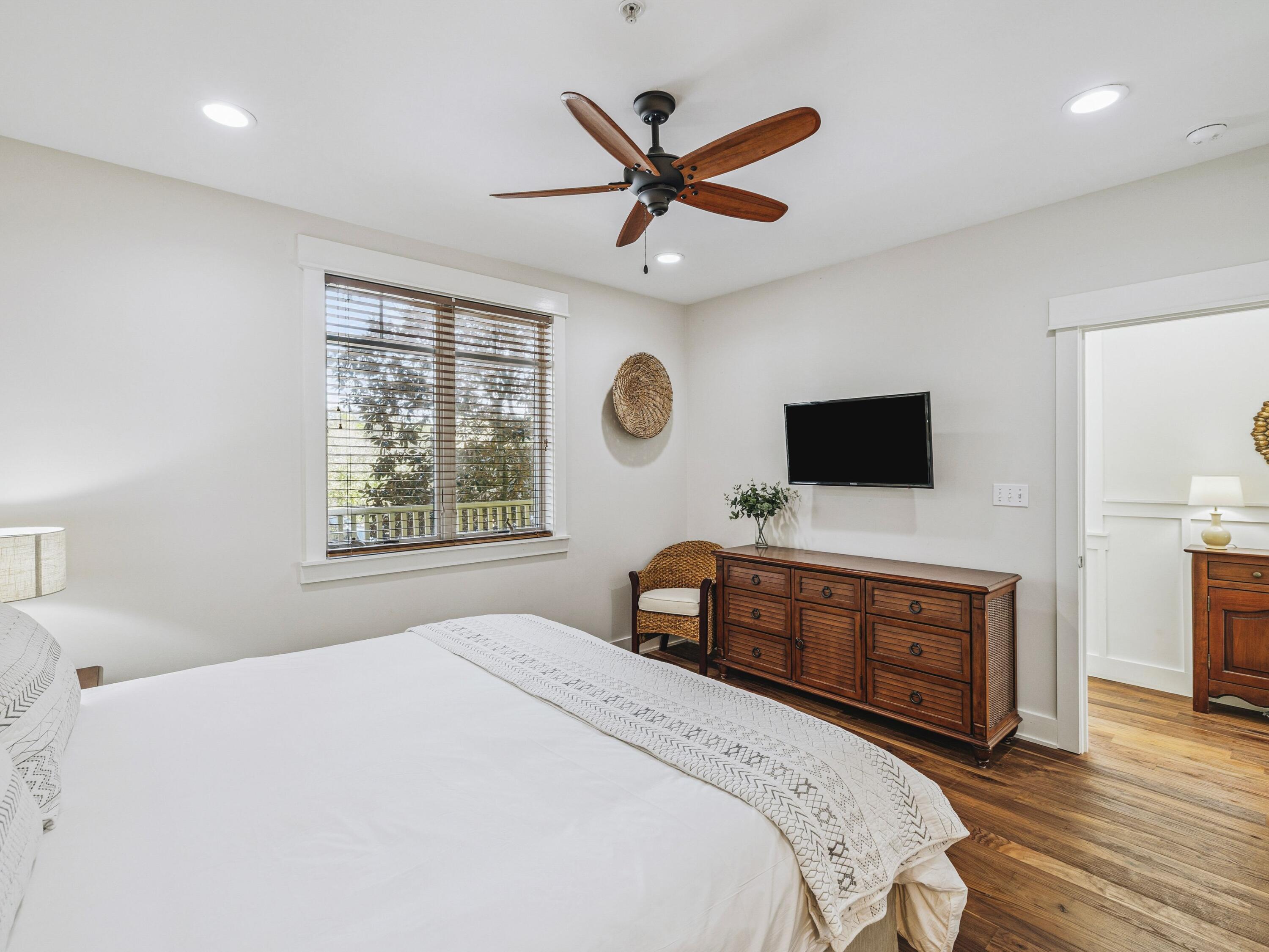 4281 East County Highway 30A, Unit 203 Santa Rosa Beach, FL 32459 - Photo 11 of 35 a bedroom with a bed and a flat screen tv