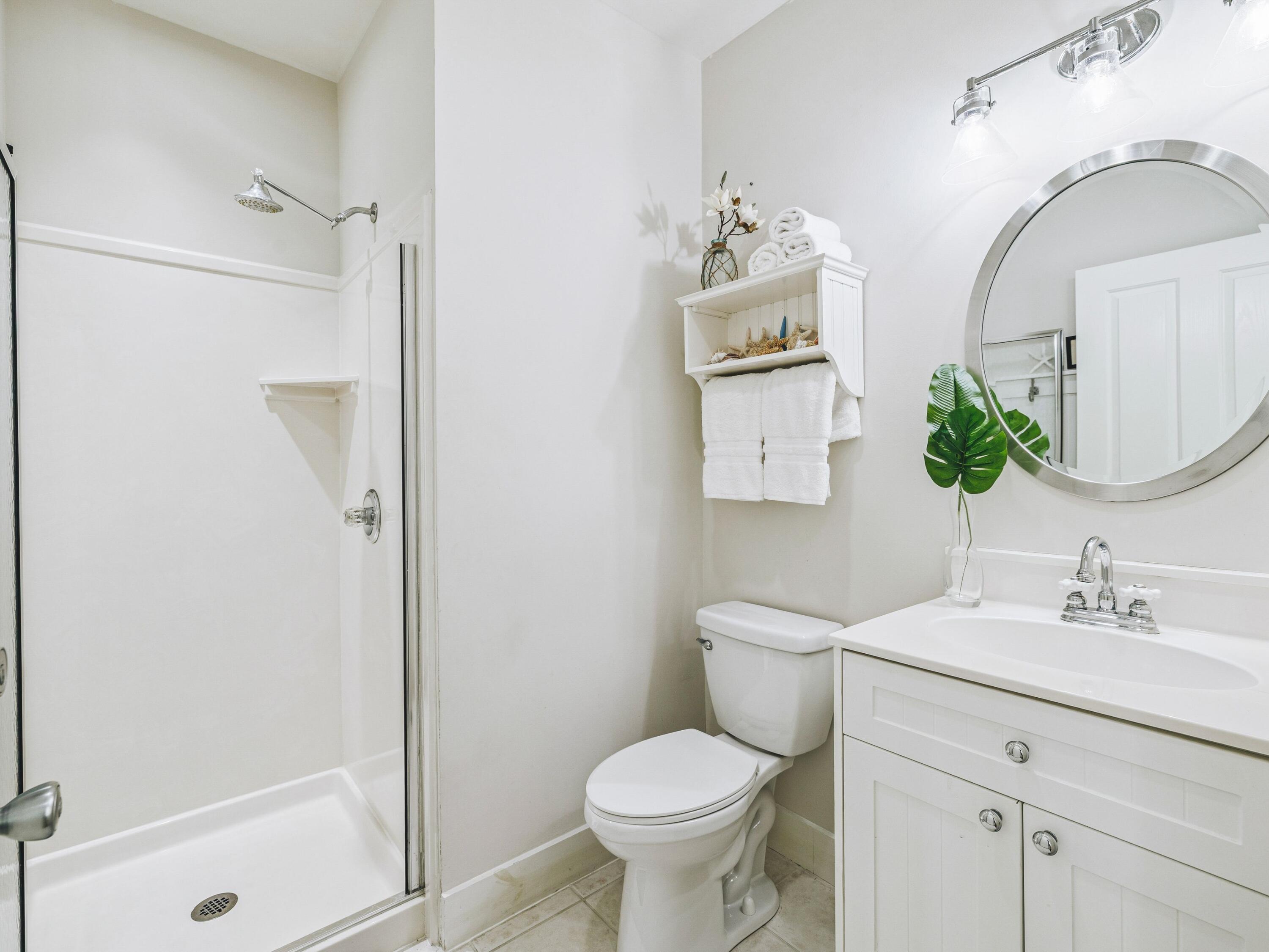 4281 East County Highway 30A, Unit 203 Santa Rosa Beach, FL 32459 - Photo 15 of 35 a bathroom with a toilet sink and shower