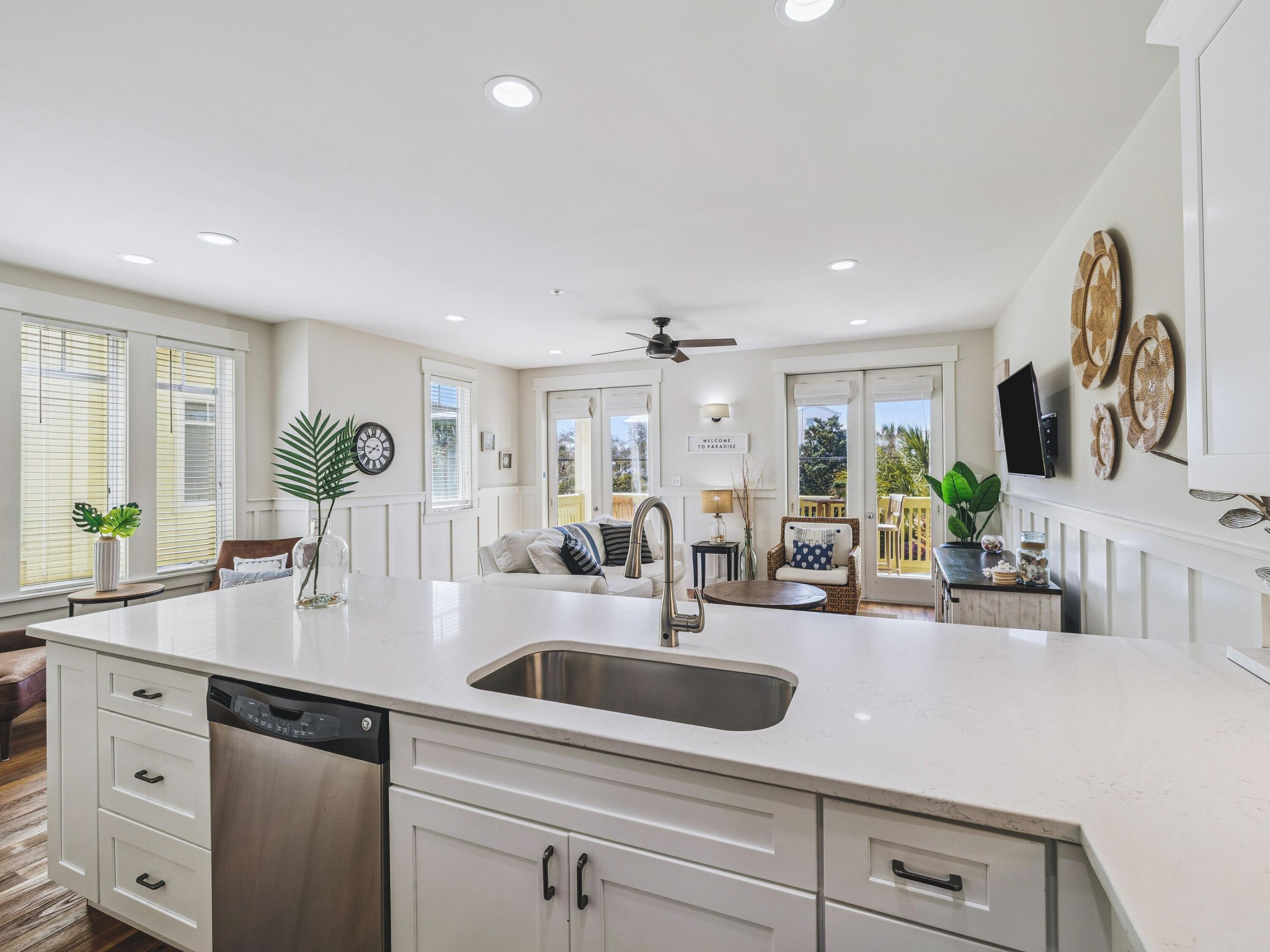 4281 East County Highway 30A, Unit 203 Santa Rosa Beach, FL 32459 - Photo 18 of 35 a kitchen with counter top space a sink and cabinets