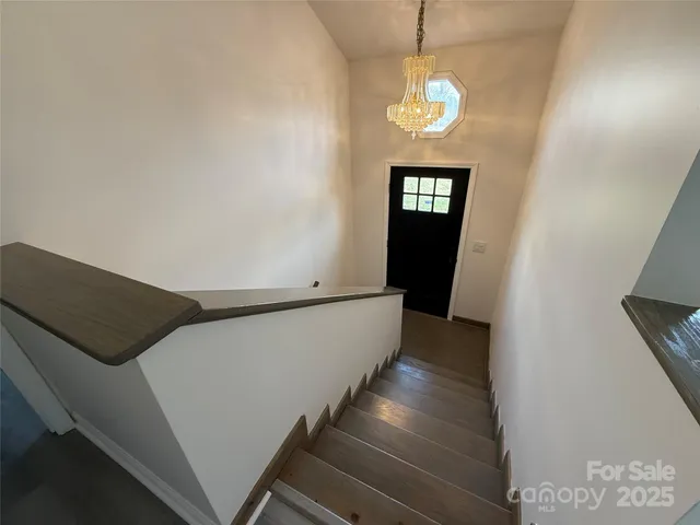 a view of an entryway with wooden floor