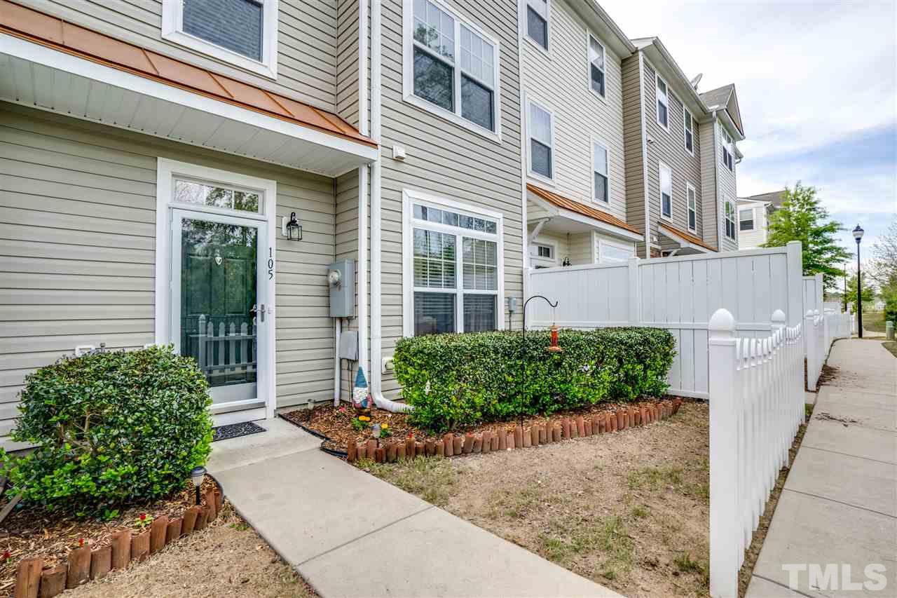 11710 Coppergate Drive, Unit 105 Raleigh, NC 27614 - Photo 1 of 24 a front view of a house with a garden