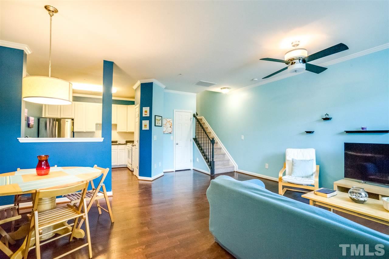 11710 Coppergate Drive, Unit 105 Raleigh, NC 27614 - Photo 6 of 24 a living room with furniture and wooden floor