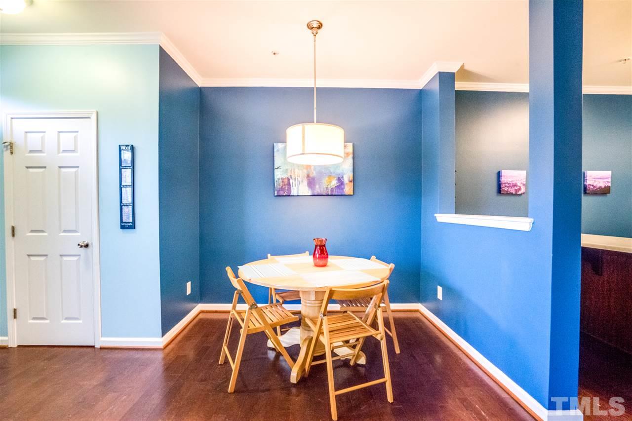 11710 Coppergate Drive, Unit 105 Raleigh, NC 27614 - Photo 7 of 24 a table and chairs in a room
