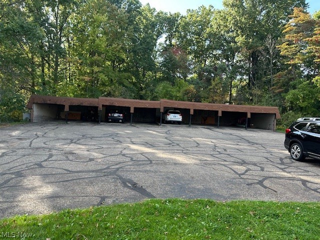 4376 Darrow Road, Unit 7 Stow, OH 44224 - Photo 23 of 23 View of parking / parking lot with a carport