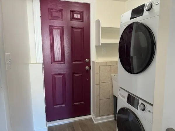 a close view of a utility room with washer and dryer