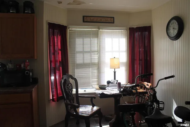 a view of a dining room with furniture and window